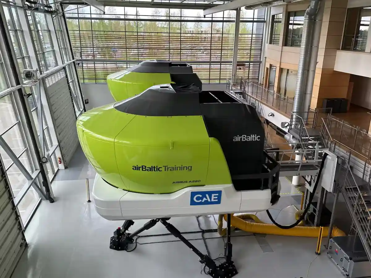 Two Airbus A220 full flight simulators inside the AirBaltic training centre simulator bay